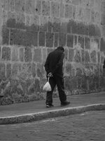 free-photo-of-back-view-of-a-man-walking-on-the-sidewalk-in-city.jpeg