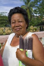 pngtree-middle-aged-filipino-woman-middle-age-religious-candles-photo-image_7663142.jpg